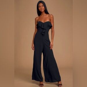 Lulus Off We Go Black Strapless Ruffled
Wide-Leg Jumpsuit